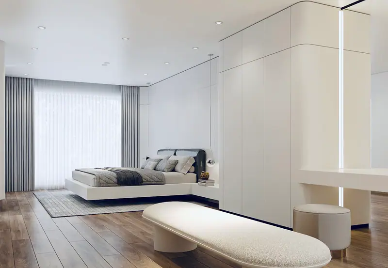 Phòng ngủ master với vách tủ trắng bo góc
