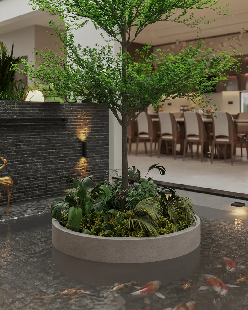 Cây xanh trong bồn tròn giữa hồ cá