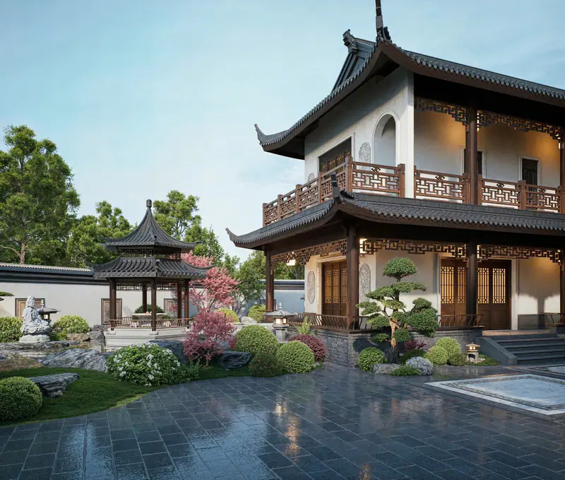 Lầu hai tầng mái cong bên sân lát đá và cây cảnh